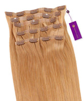 Perfect Locks Straight Seamless Clip-In Hair Extensions in Pumpkin Gold have layered wefts, small top clips, and a purple tag.#color_honey-blonde-(27)