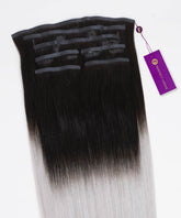 Straight Seamless Clip-In Hair Extensions by Perfect Locks, rooted black to silver, shown with a purple Perfect Locks tag attached.#color_rooted-black-to-silver-(1B/S)