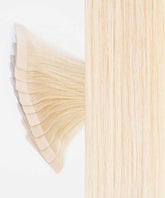 Close-up of Perfect Locks Straight Classic Tape-In Hair Extensions in Platinum Blonde  with fanned-out wefts on the left and smooth, straight Remy human hair texture on the right against a white background.#color_ash-blonde-(60)