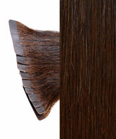Close-up of Perfect Locks Straight Classic Tape-In Hair Extensions in Chocolate Brown, with stacked adhesive tape wefts and smooth strands.#color_chocolate-brown-(3)