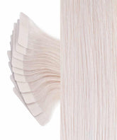 Close-up of several Perfect Locks Straight Classic Tape-In Hair Extensions in Dark Auburn  fanned out left, with a straight, smooth section of the same extensions on the right.#color_ice-blonde-(60S)