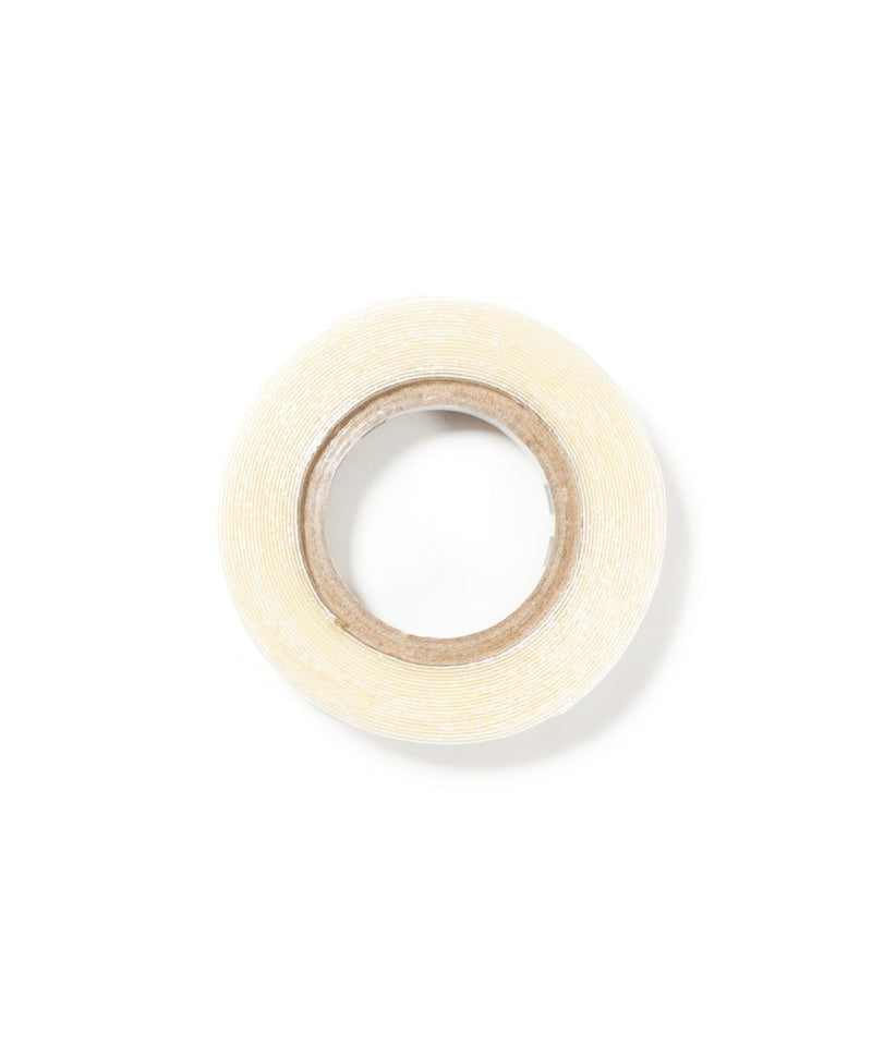 The Supertape 1/3" x 3 Yard Roll by True Tape from Perfect Locks is shown from above with a brown cardboard core on a white background—ideal for securing hair extensions.