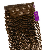 A set of Perfect Locks Tight Curly Classic Clip-In Hair Extensions in Chocolate Brown with metal clips and a purple Brett Loxes tag.#color_chocolate-brown-(3)
