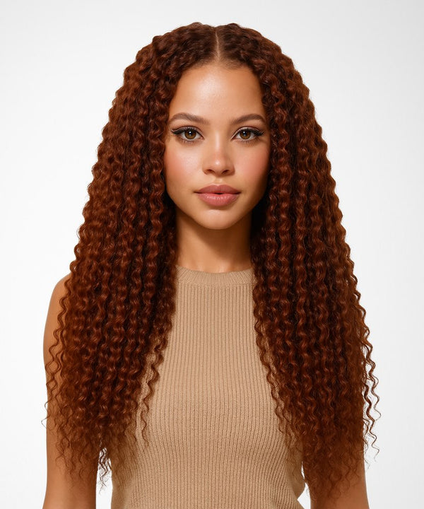 Woman with long, curly brown hair against a white background