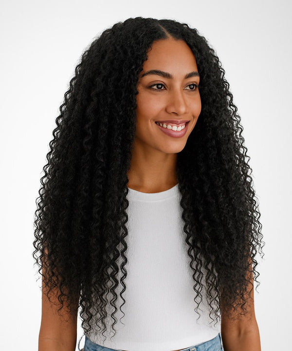 Woman with long, curly black hair wearing a white shirt against a white background