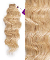 Perfect Locks Wavy Hand-Tied Weft Rows (2oz) in Rooted Toasted Blonde are bundled, close up shows shiny, smooth Remy texture.#color_platinum-blonde-(613)