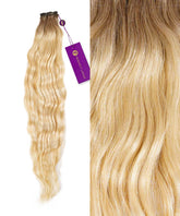 On the left, Perfect Locks Wavy Hand-Tied Weft Rows in Caramel Blonde Highlights with dark roots beside a close-up of their shiny waves. A purple tag is attached to these human hair extensions.#color_rooted-cocoa-blonde-(18/613)