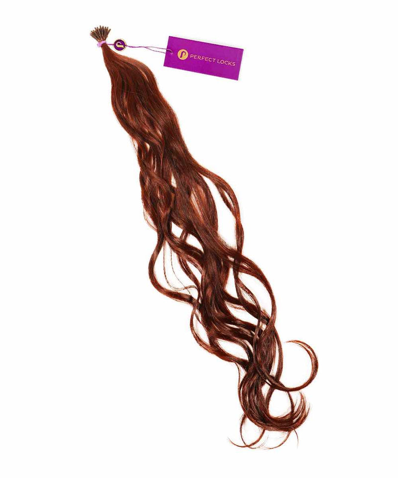 A bundle of long, wavy Chocolate Brown  Remy hair extensions labeled Wavy Fusion I-Tip Hair with a purple tag at the top.
