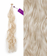 Perfect Locks' Wavy Fusion I-Tip Hair in ice blonde shown up close, featuring loose waves and a soft, shiny texture.#color_ice-blonde-(60S)