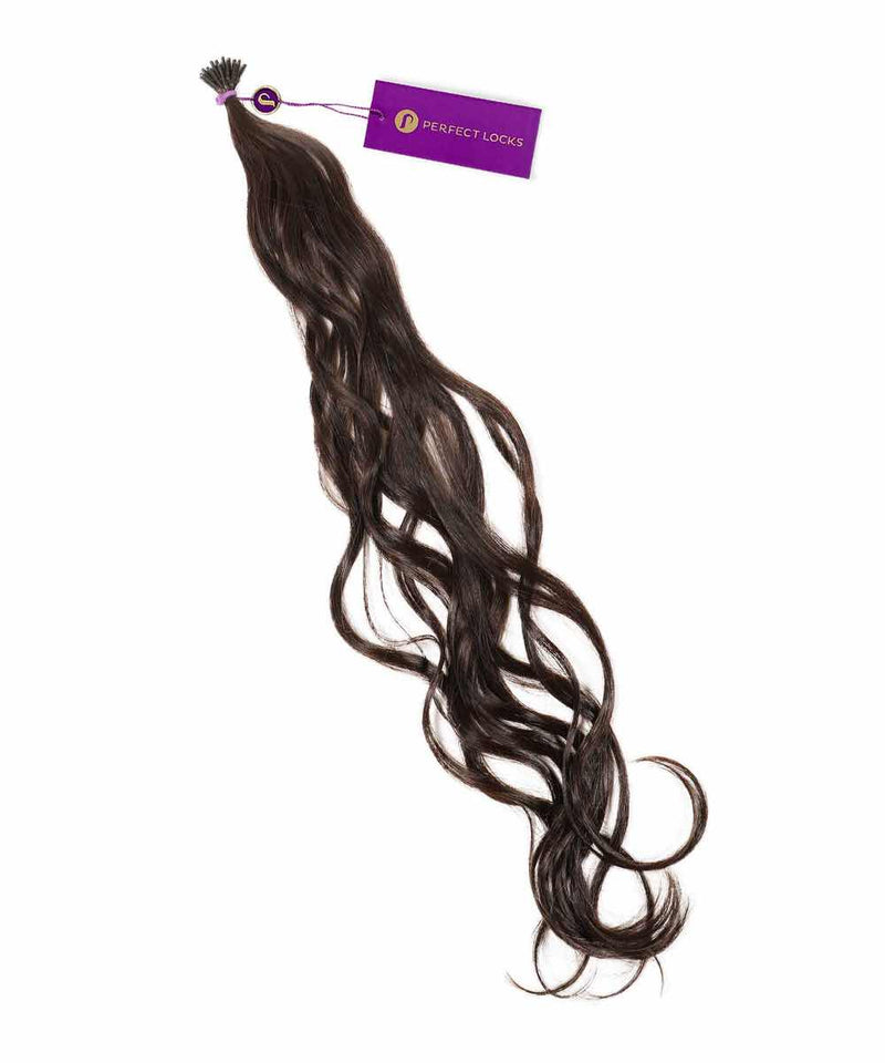 A bundle of long, wavy, platinum blonde  Remy Wavy Fusion I-Tip Hair from Perfect Locks with a purple tag near the top.