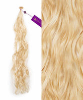 On the left is Perfect Locks' Wavy Fusion I-Tip Hair in Platinum Blonde ; right shows a close-up of its wavy texture. Extensions have a small loop and purple tag.#color_platinum-blonde-(613)