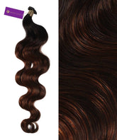 A bundle of Perfect Locks Wavy Hybrid Weft Hair Extensions in Champagne Highlights (18A/60), shown single and close-up to showcase textured, glossy waves.#color_Chestnut-Brown-Balayage-(400/401/404)