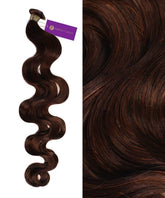 A bundle of Wavy Hybrid Weft Hair Extensions by Perfect Locks in Highlighted Brown Auburn, with a purple tag, beside a close-up of its smooth, shiny waves.#color_chocolate-brown-(3)