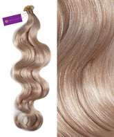 On the left, Perfect Locks Wavy Hybrid Weft Hair Extensions in Ice Blonde shimmer as a close-up on the right shows their smooth texture.#color_ice-blonde-(60S)