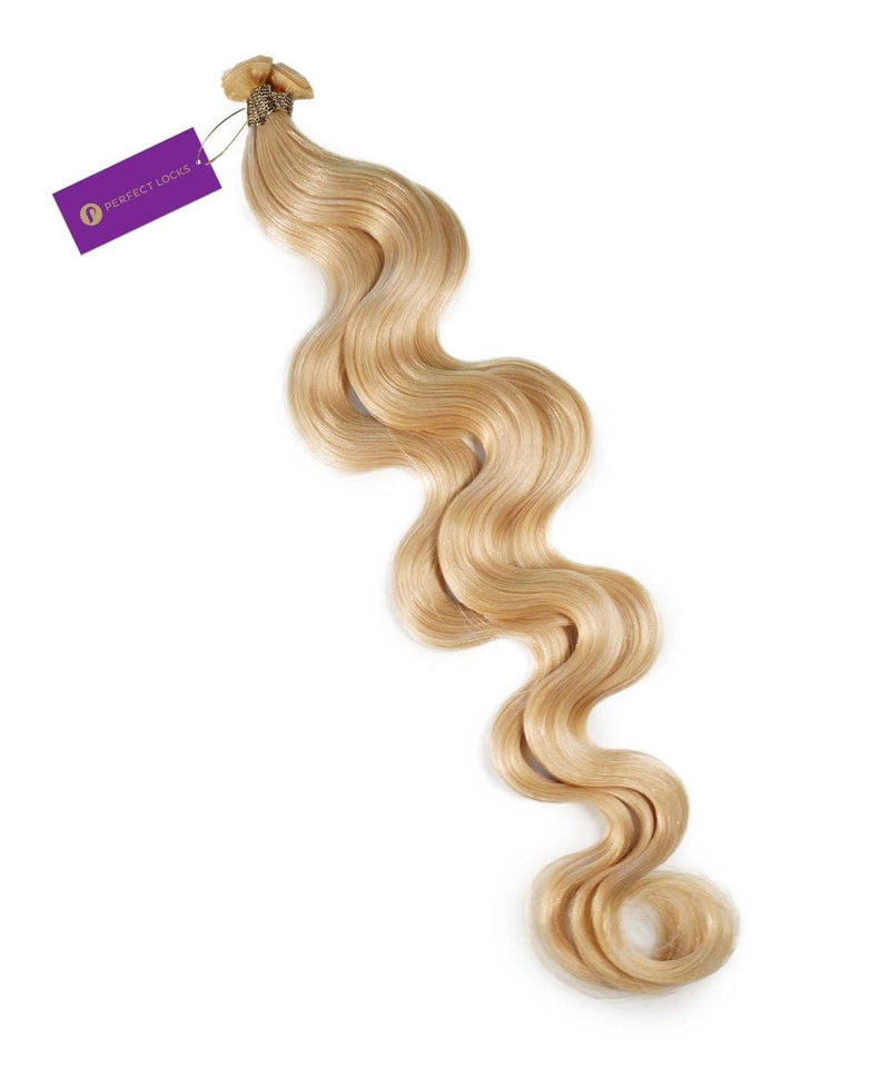 A long, wavy Chocolate Brown  Hybrid Weft Hair Extension with a smooth texture, laid flat, bundled at the top, secured by a purple Perfect Locks tag.