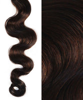 Close-up of Perfect Locks Wavy Invisi Tape In Hair Extensions in Dark Brown . Left: defined wave on white; right: smooth, shiny Remy texture.#color_dark-brown-(2)