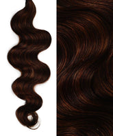 Split image: Left displays Perfect Locks Wavy Invisi Tape In Hair Extensions in Rooted Caramel Blonde; right shows shiny, highlighted waves.#color_highlighted-brown-auburn-(30/31/33)