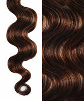 Close-up of Perfect Locks Wavy Invisi Tape In Hair Extensions in silvery ash brown; left side shows a defined curl, right a smooth wave.#color_silvery-ash-brown-(4A/18A)