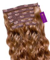 A set of Perfect Locks Wavy Classic Clip-In Hair Extensions in Golden Brown  arranged in a fan shape, clips at the top, purple brand tag.#color_golden-brown-(6)