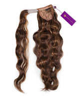 The Wavy Clip-In Ponytail Extension by Perfect Locks features warm mocha lowlights and attaches easily with a beige lace clip.#color_warm-mocha-lowlights-(2/4/6)