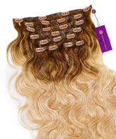 Perfect Locks Wavy Seamless Clip-In Hair Extensions in flawless blonde balayage displayed neatly with branded clips and a purple tag.#color_flawless-blonde-balayage-(22/613)