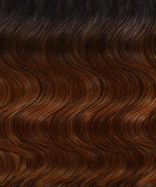 rooted chocolate mocha (1B/4) wavy tape in hair extensions by Perfect Locks