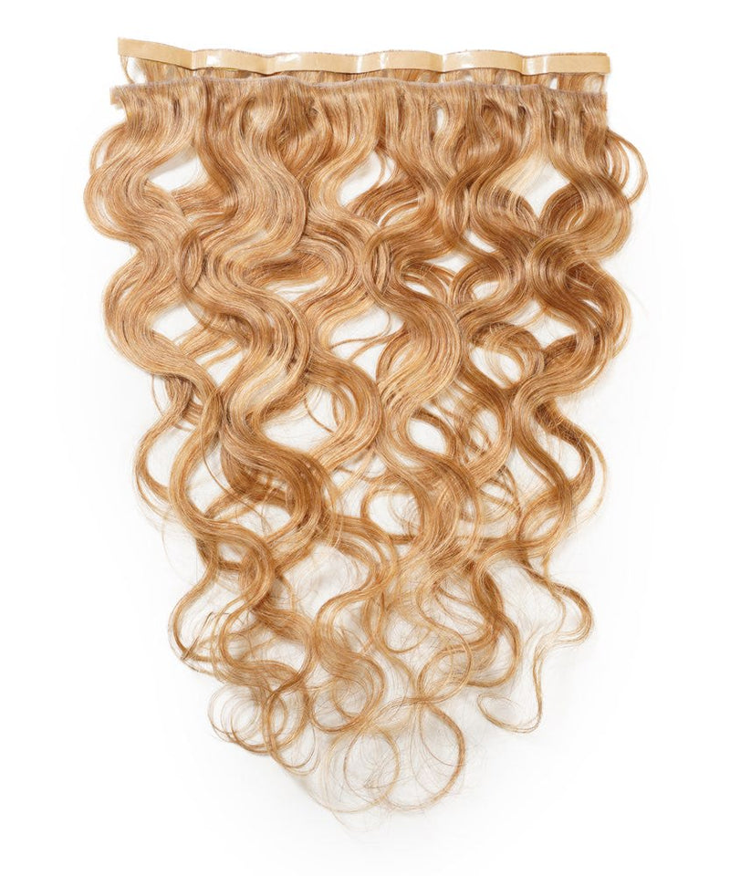 Perfect Locks Wavy Seamless Tape In Weft in Honey Blonde  with wavy human hair extensions, transparent top band, on white background.