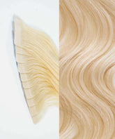 Perfect Locks Wavy Classic Tape-In Hair Extensions in Golden Brown  showcase smooth, shiny waves, highlighting quality and natural look.#color_platinum-blonde-(613)