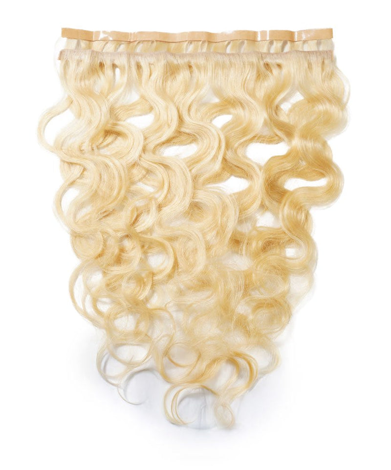 The Perfect Locks Wavy Seamless Tape In Weft in Platinum Blonde  on a white background, with shiny, voluminous loose waves.