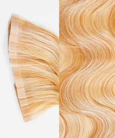 Close-up of Perfect Locks Wavy Classic Tape-In Hair Extensions in Honey Blonde Ombre (12/27/613) shows smooth, natural texture and lustrous shine.#color_caramel-blonde-highlights-(24/27/613)