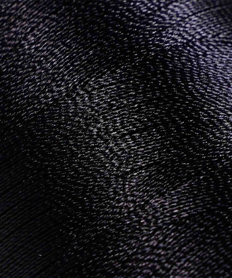 Close-up of smooth, shiny satin fabric with a subtle wavy texture and reflective highlights, creating a soft, rippling effect.