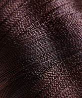 Tightly wound, shiny dark brown thread reveals intricate texture and fine strands, highlighting the rich detail of the material.