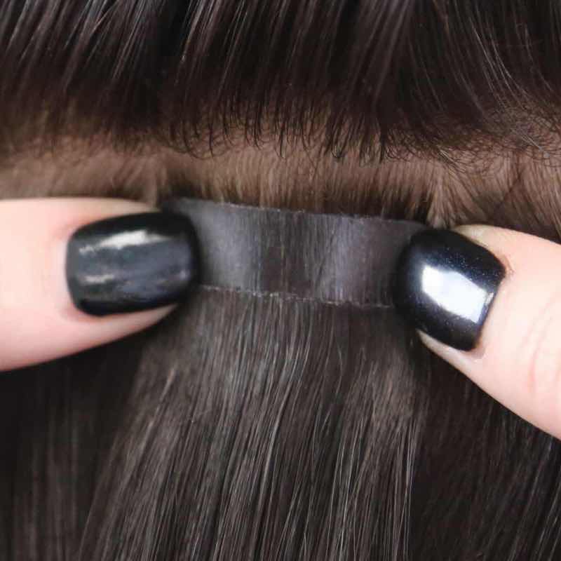 Step 3: Place and Stick.  Firmly secure the tab against your hair.