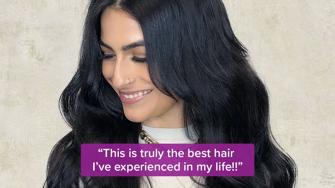 A woman with long, wavy black hair smiles while looking down. Overlaid text reads: ‚ÄúThis is truly the best human hair I‚Äôve experienced in my life!!‚Äù.
