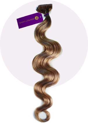 A bundle of long, wavy, light brown hair extensions with a purple tag, beautifully displayed against a soft circular background.
