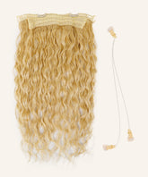 Curly Perfect Crown Hair Extensions by Perfect Locks in platinum blonde with lace and clip attachments beside two clear elastic hairbands with beige clips, all on a white background.#color_platinum-blonde-(613)