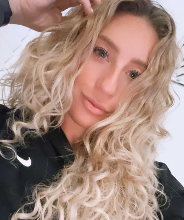 ash blonde (60) curly tape in hair extensions by Perfect Locks