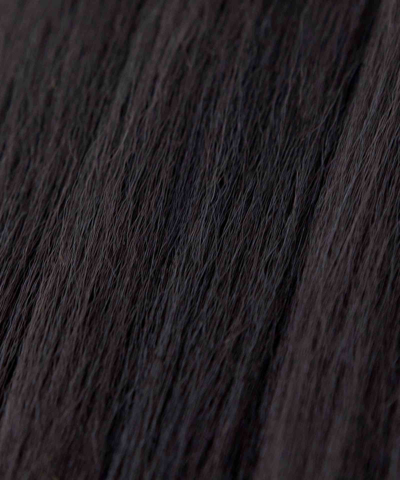 Close-up of natural black, straight hair strands with fine texture and natural shine from Perfect Locks Relaxed Straight Perfect Crown Hair Extensions.