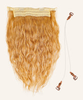 The Wavy Perfect Crown Hair Extensions in honey blonde have Remy hair, lace top, clear wires with brown clips on a light background.#color_honey-blonde-(27)