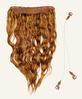 The Wavy Perfect Crown Hair Extensions by Perfect Locks in toffee blonde highlights with clips, two clear wires, brown fasteners on a light background.#color_toffee-blonde-highlights-(4/27)