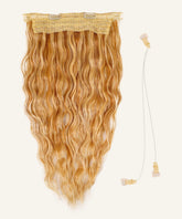 Perfect Locks Wavy Perfect Crown Hair Extensions in caramel blonde highlights with lace clips and clear elastic wire are displayed together.#color_caramel-blonde-highlights-(24/27/613)