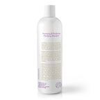 A tall white clarifying shampoo bottle with purple and tan text under a gray flip cap. Minimal design highlights key info.