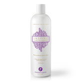 A white Perfect Locks Inspire Clarifying Shampoo bottle with a purple label promotes scalp health, removes build-up, and features natural ingredients like sage and cucumber.