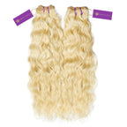 Two bundles of long, wavy, blonde hair extensions are laid side by side, each with a purple Perfect Locks tag at the top.