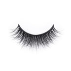 A single false eyelash strip with long, wispy black lashes, slightly curved for a natural look, displayed on a white background.