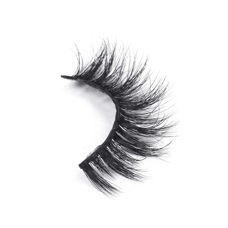A single strip of dramatic, thick, black false eyelashes with a curved shape showcased on a white background for a bold look.
