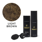 A close-up of Light Brown Hair Building Fibers by Perfect Locks is shown in a circular frame above three items: a bottle labeled Black/Negro, a spray bottle labeled Lace in Place Mist, and a black applicator bulb.#color_light-brown