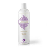 A white bottle of Perfect Locks Inspire Hydrating Conditioner with purple design, enriched with argan oil and free of harsh additives.
