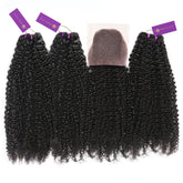 Four bundles of tightly curled virgin black hair extensions with purple tags are displayed in a row, with a matching lace closure piece at the top center.