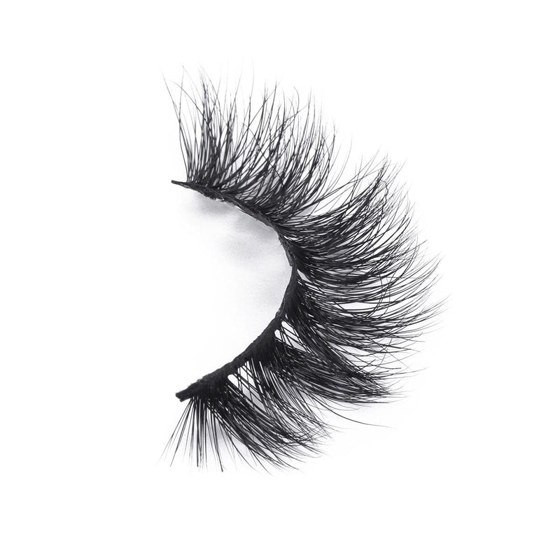 Black false eyelashes are displayed against a white background, highlighting their elegant volume.
